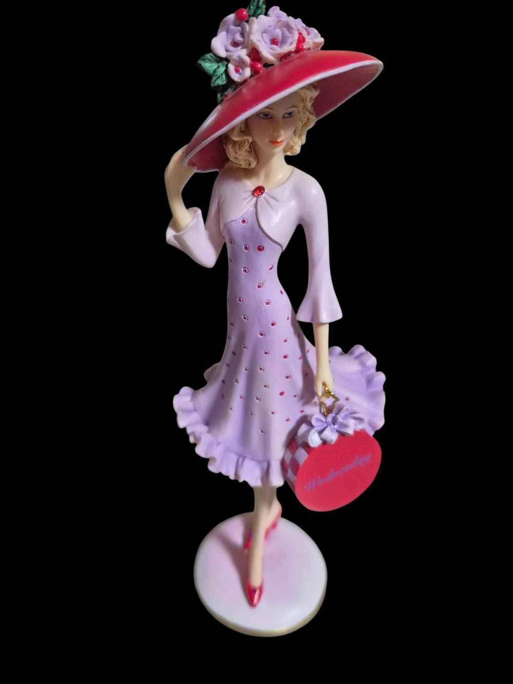 Hats Of The Week Collection. Wednesday Lady. Red Hat Purple Dress Figurine